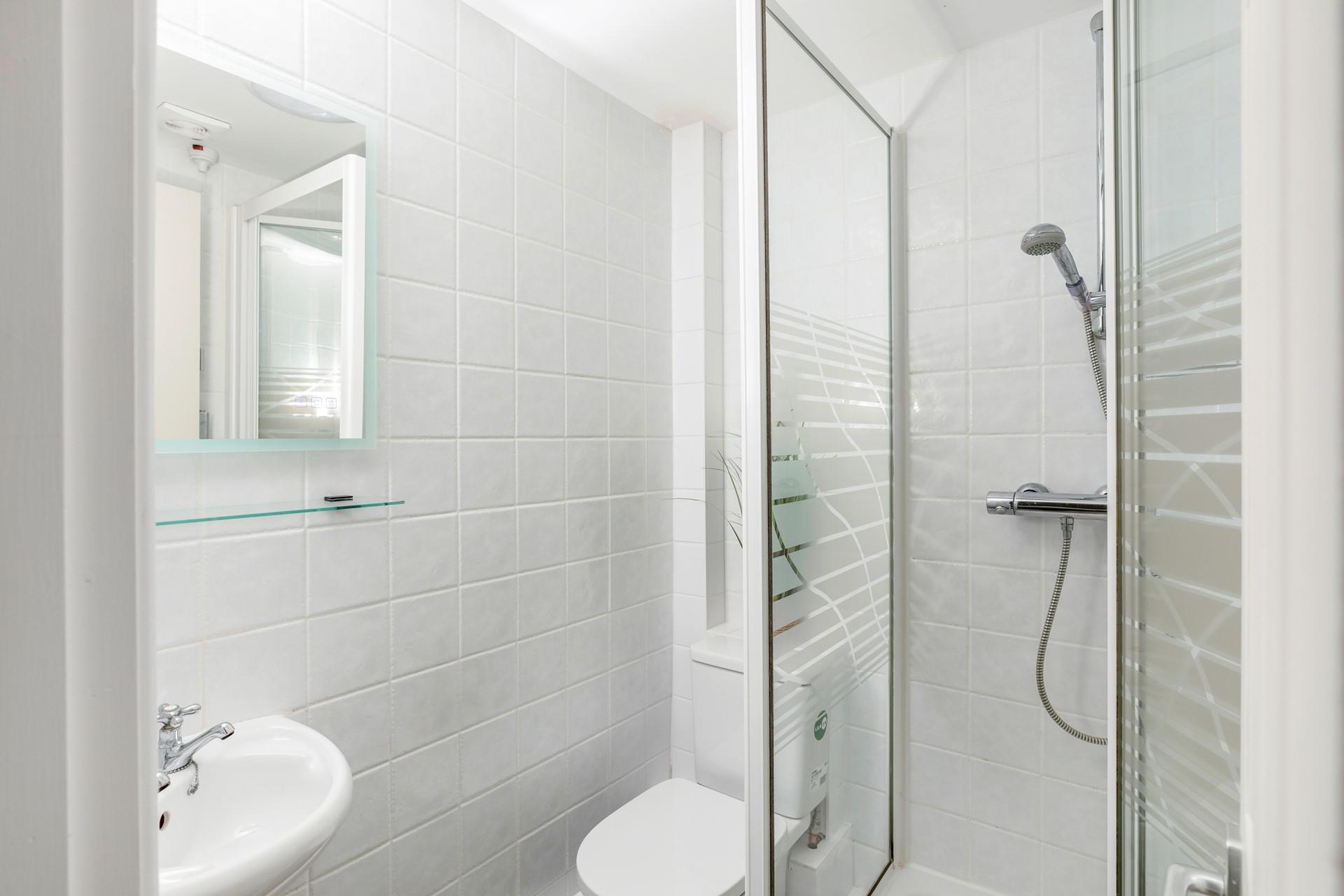 Wash off sandy toes in the shower after a day on Sennen beach.