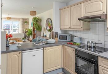 The well-equipped kitchen has all your essentials, as well as a washing machine and dishwasher.