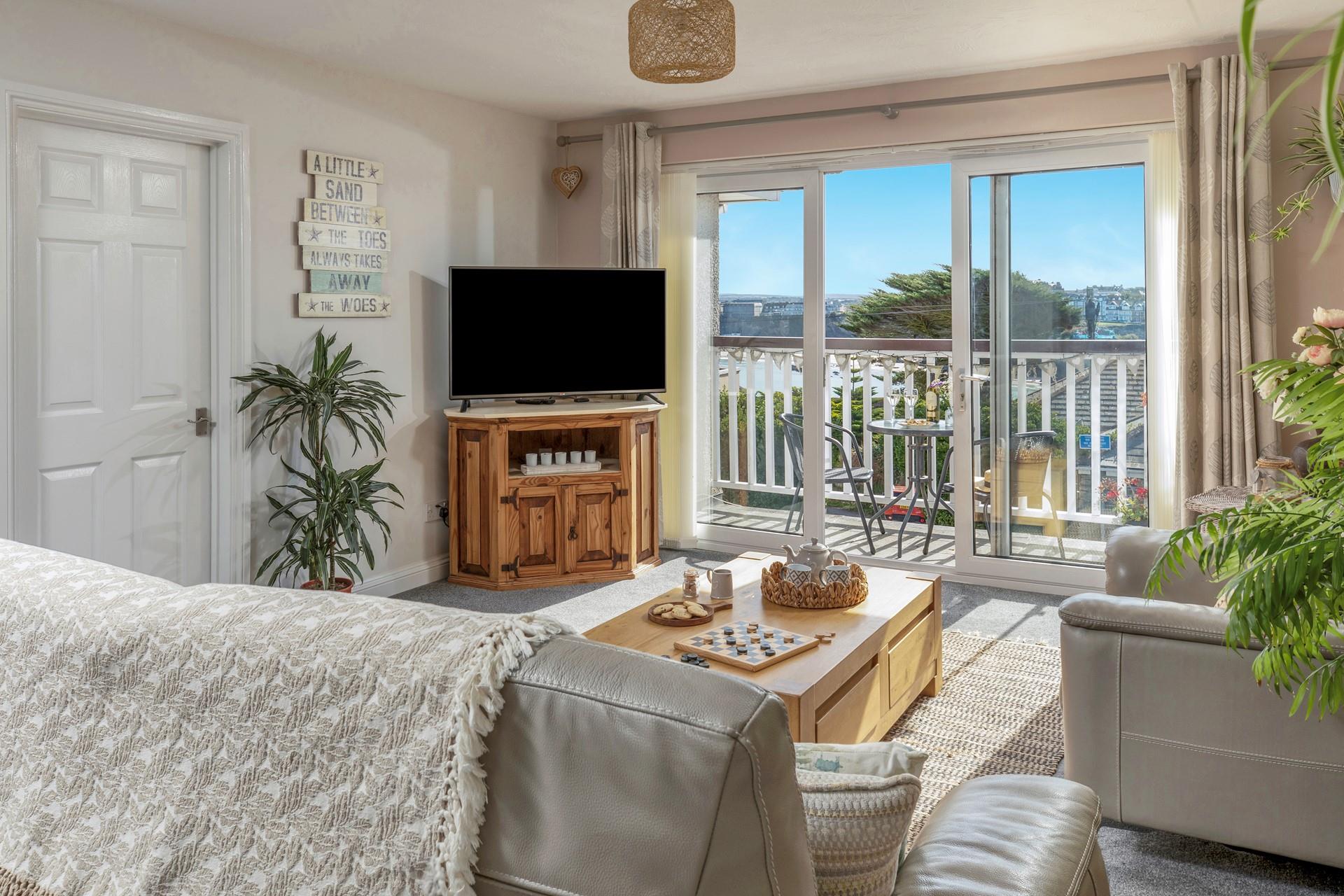 You can chill out in the cosy living area, with the doors open to let in the fresh Cornish air.