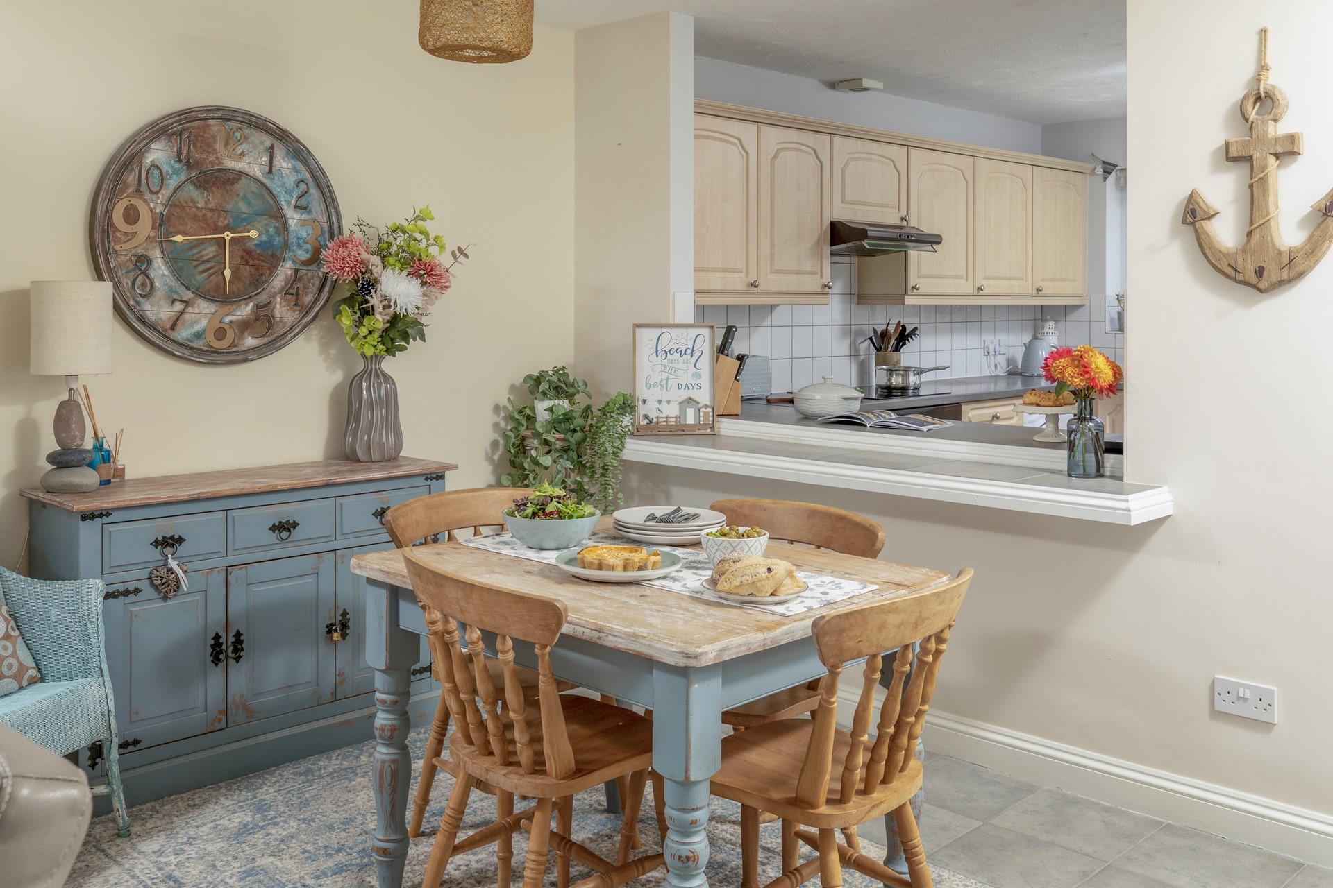 The window through to the kitchen makes a lovely sociable space for preparing a home cooked meal.