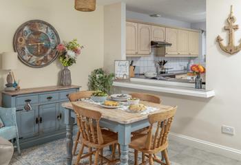 The window through to the kitchen makes a lovely sociable space for preparing a home cooked meal.