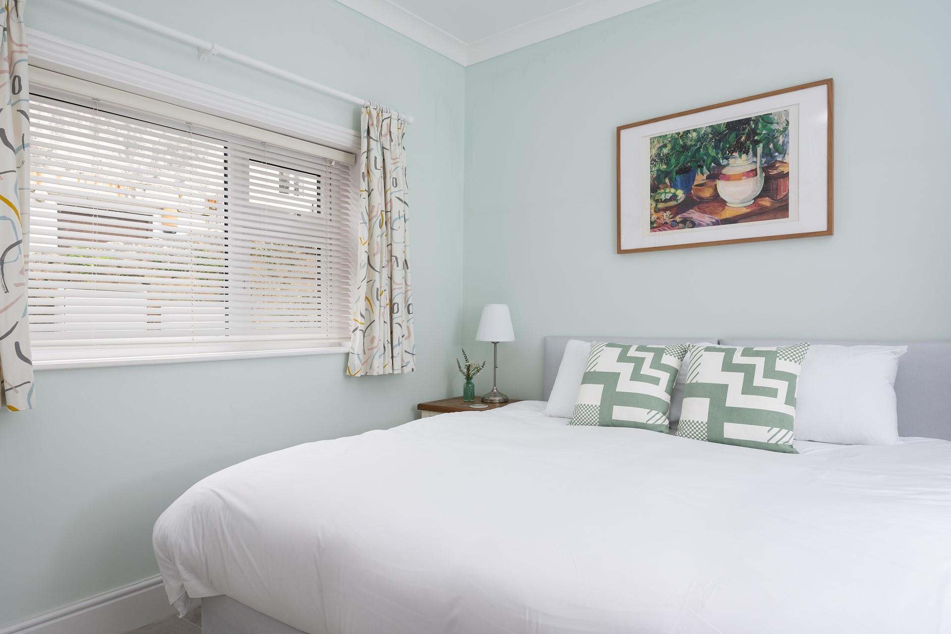 Bedroom 1, located at the rear of the house, has its own entrance direct from the garden.