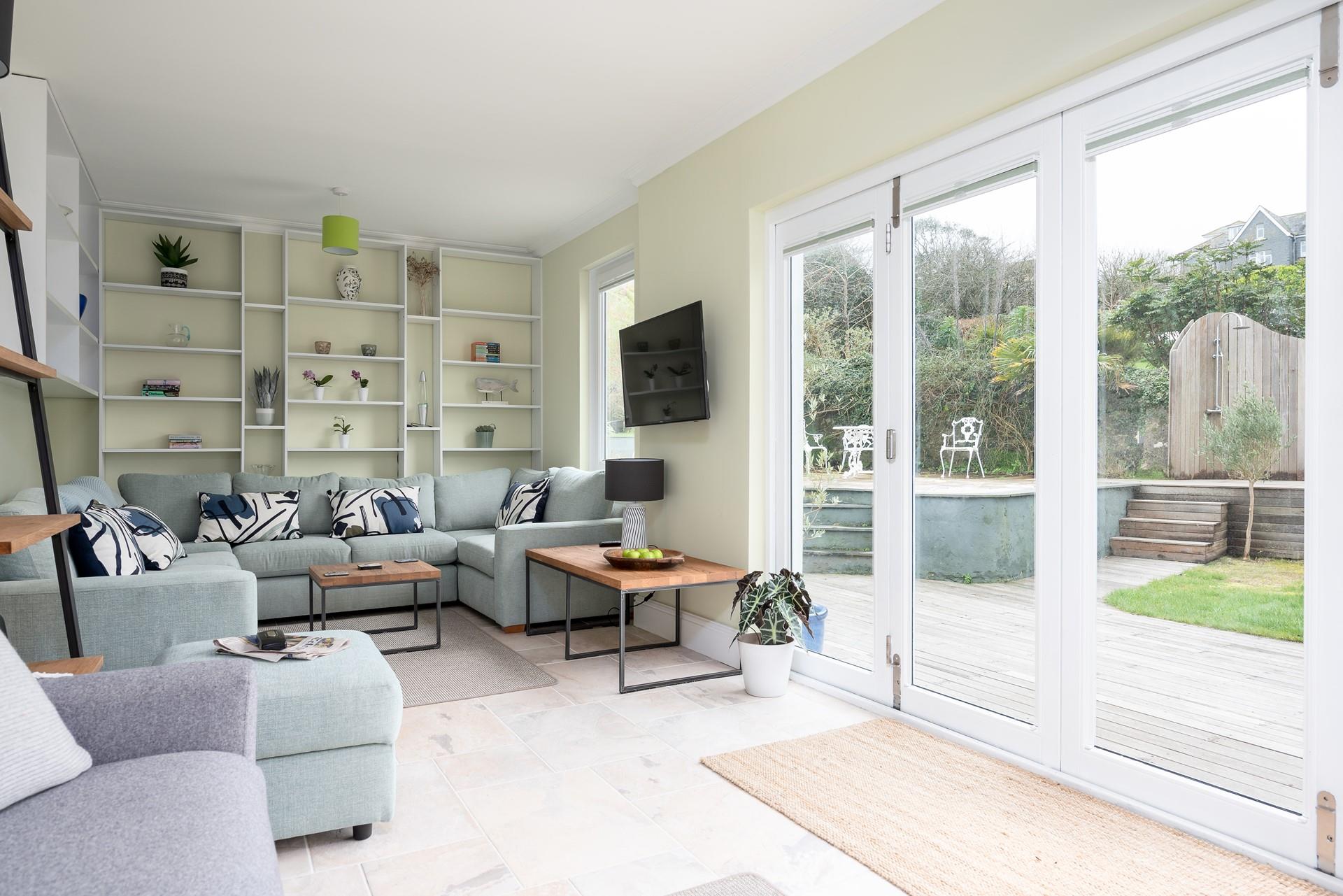 The lounge is located on the first floor. On warmer days, open up the bi-fold doors and let the sun shine in. 