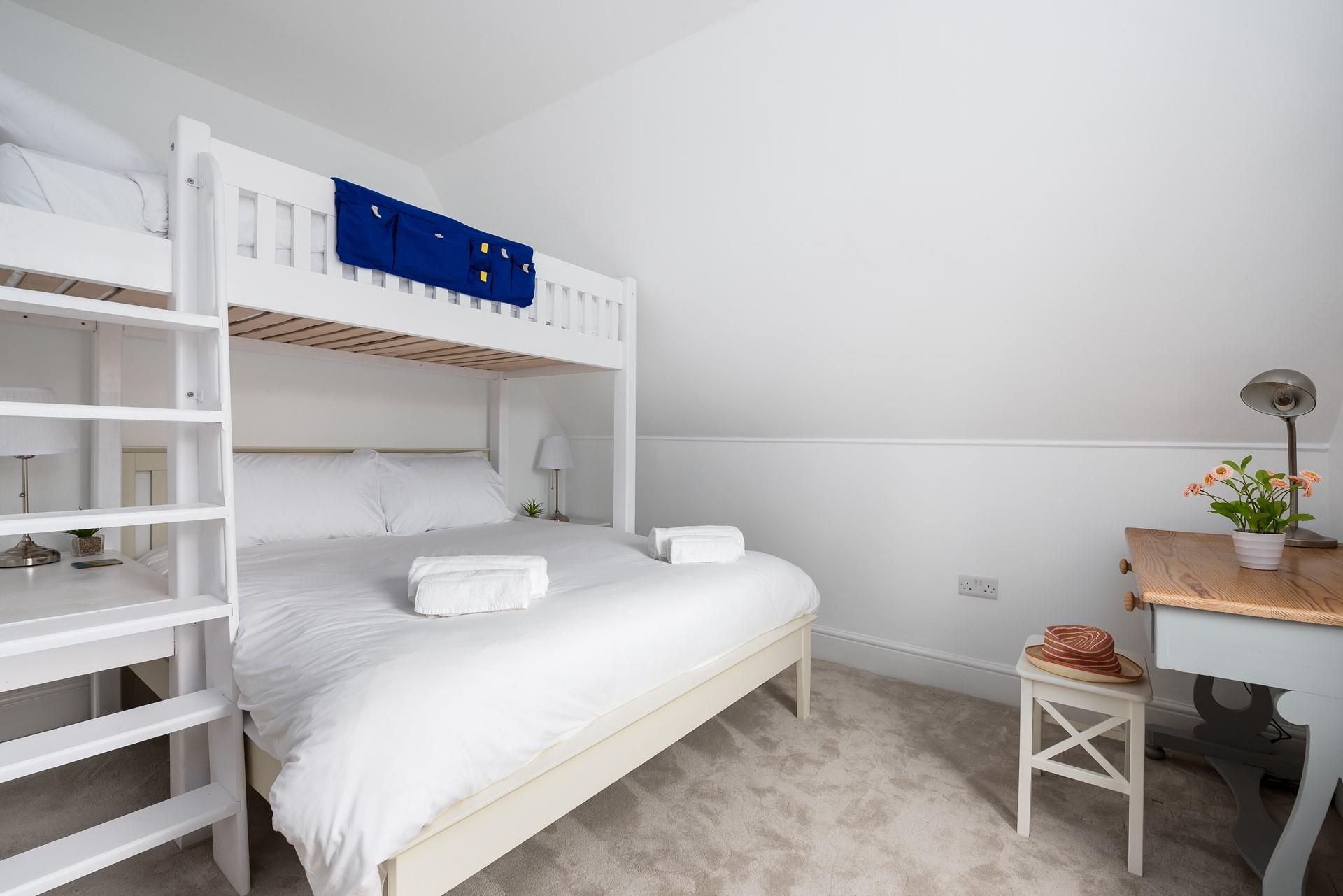 The single bunk bed in bedroom 4 was custom made to fit perfectly above the king size bed, ideal for a family sharing. 