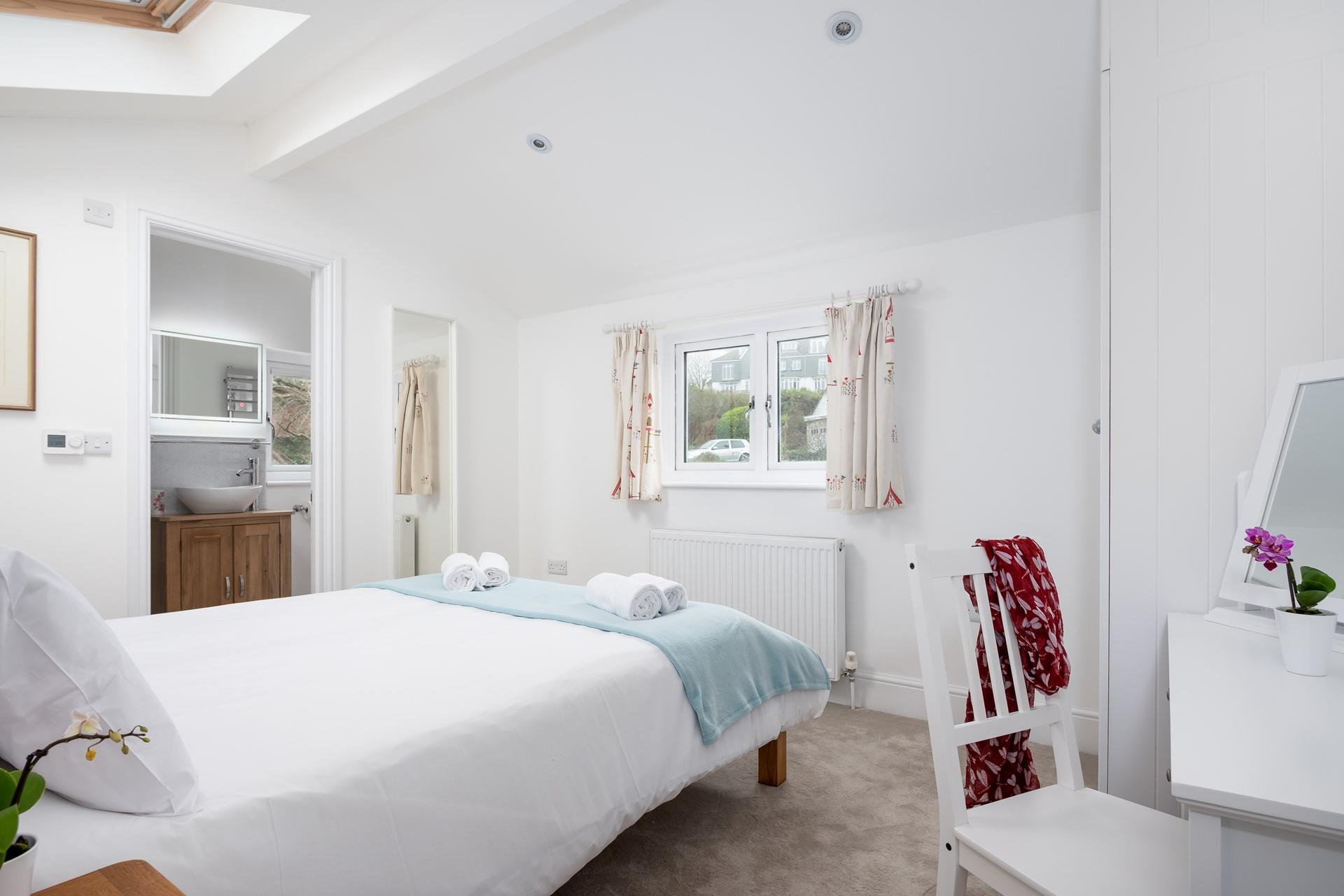 Bedroom 3 offers privacy for getting ready in the morning, with its own en suite and dressing table. 