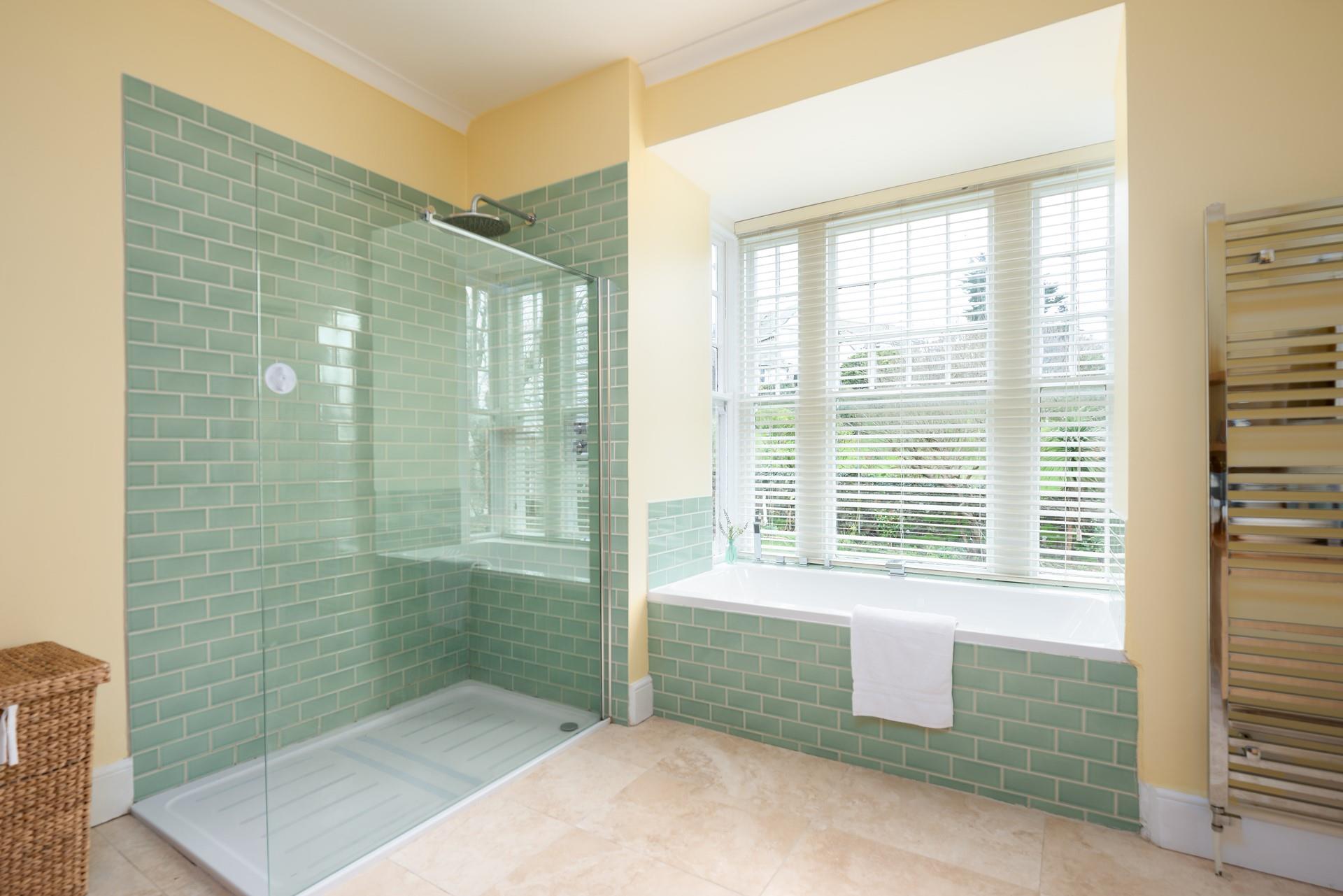 Wash off the sand from a day at the beach in the large walk in rainfall shower.