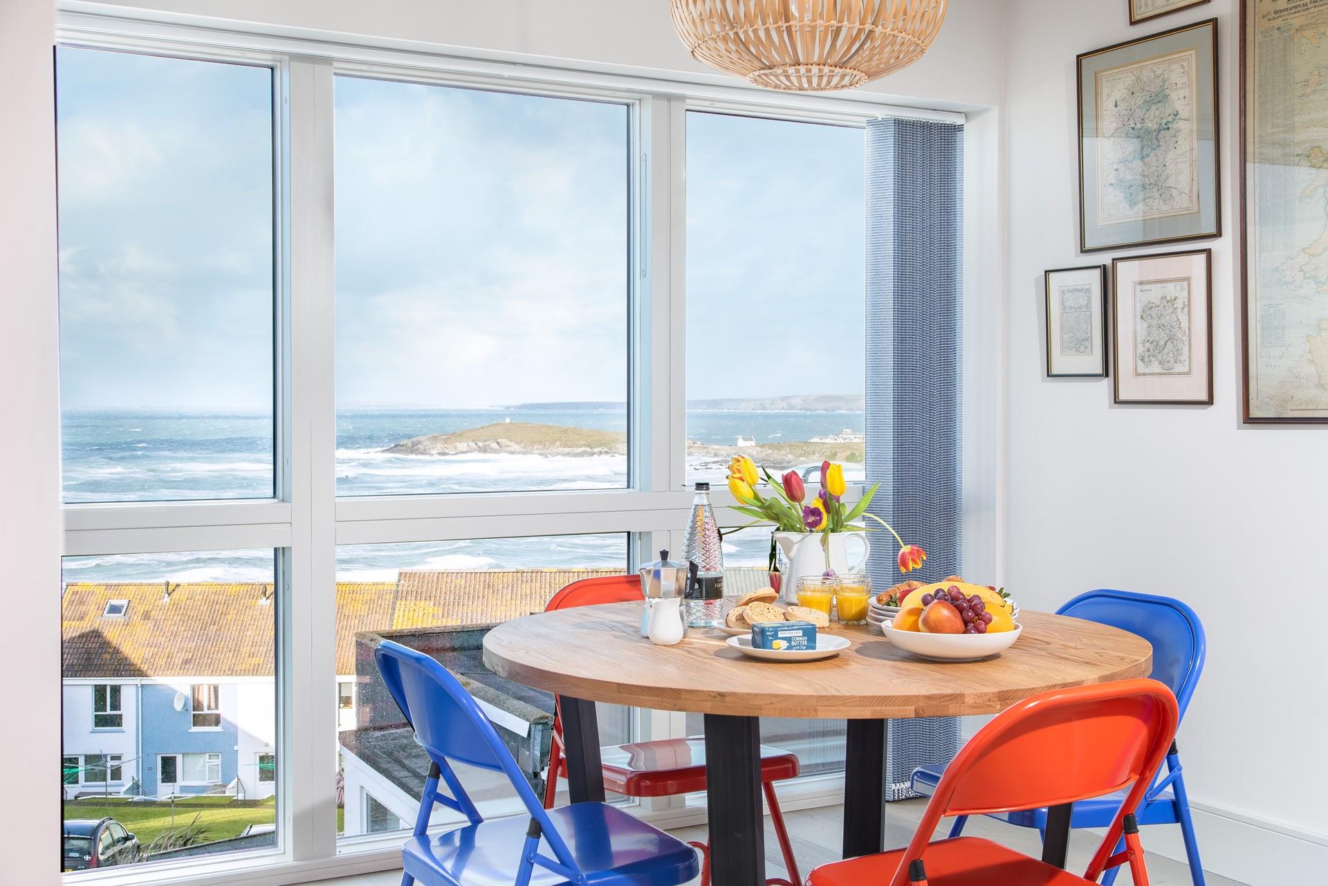 Funky, colourful touches add character to this super stylish space, where you can enjoy views of Fistral whilst enjoying dinner. 