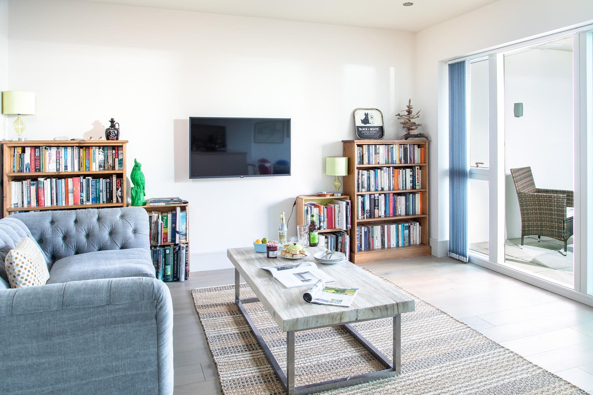 Open the doors to the balcony and let the warm summer breeze into the apartment.