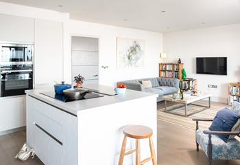 The open plan living area means you can sit and relax while your delicious dinner is cooking.