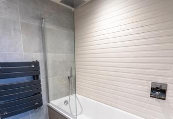 The luxury en suites with rainfall showers, are perfect for relaxing after a busy day at the beach.