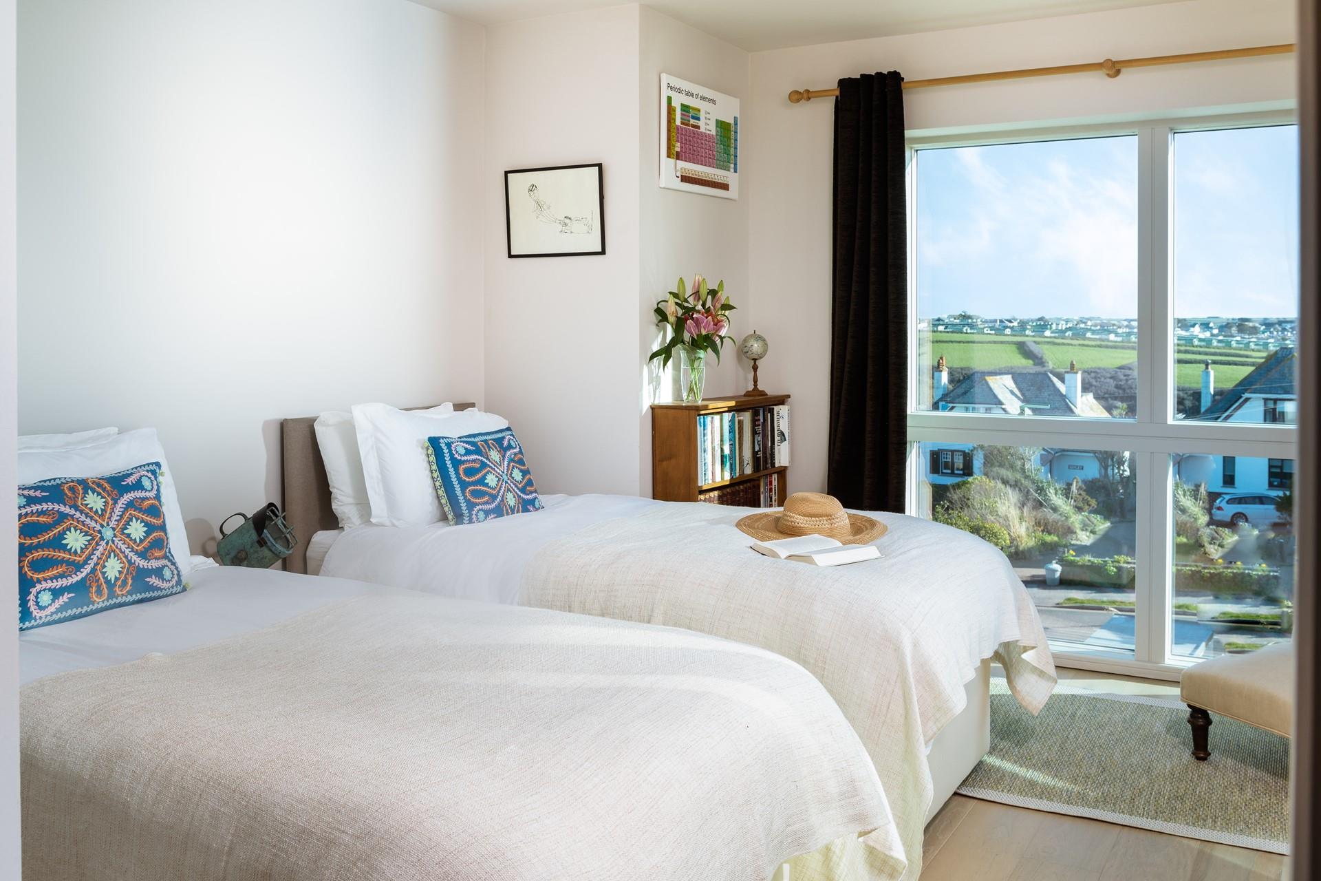 The views south stretch across the countryside and grassy headlands towards Crantock.