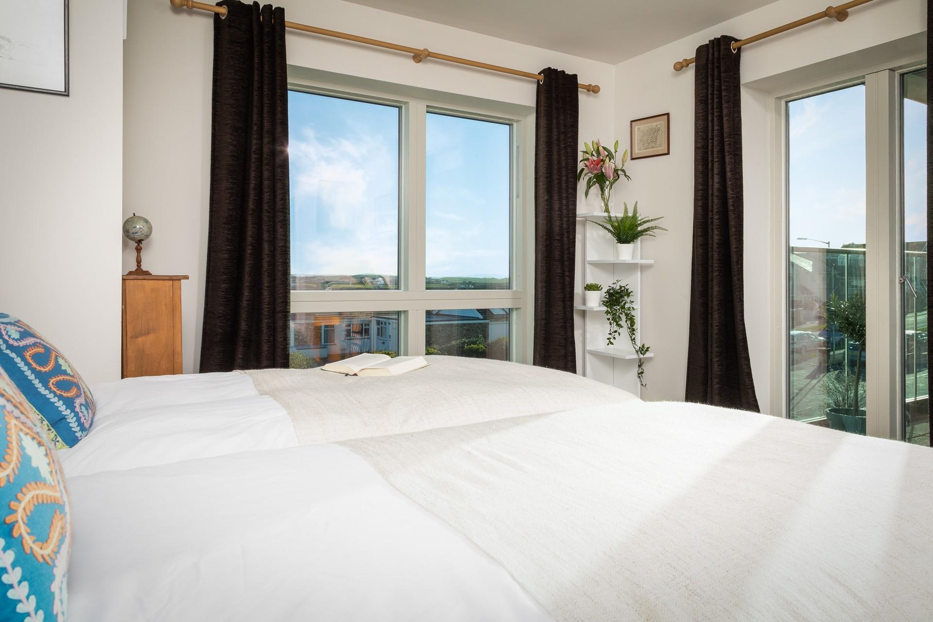 There are doors to the front balcony from both bedrooms, so you can step out of bed into the fresh Cornish air. 