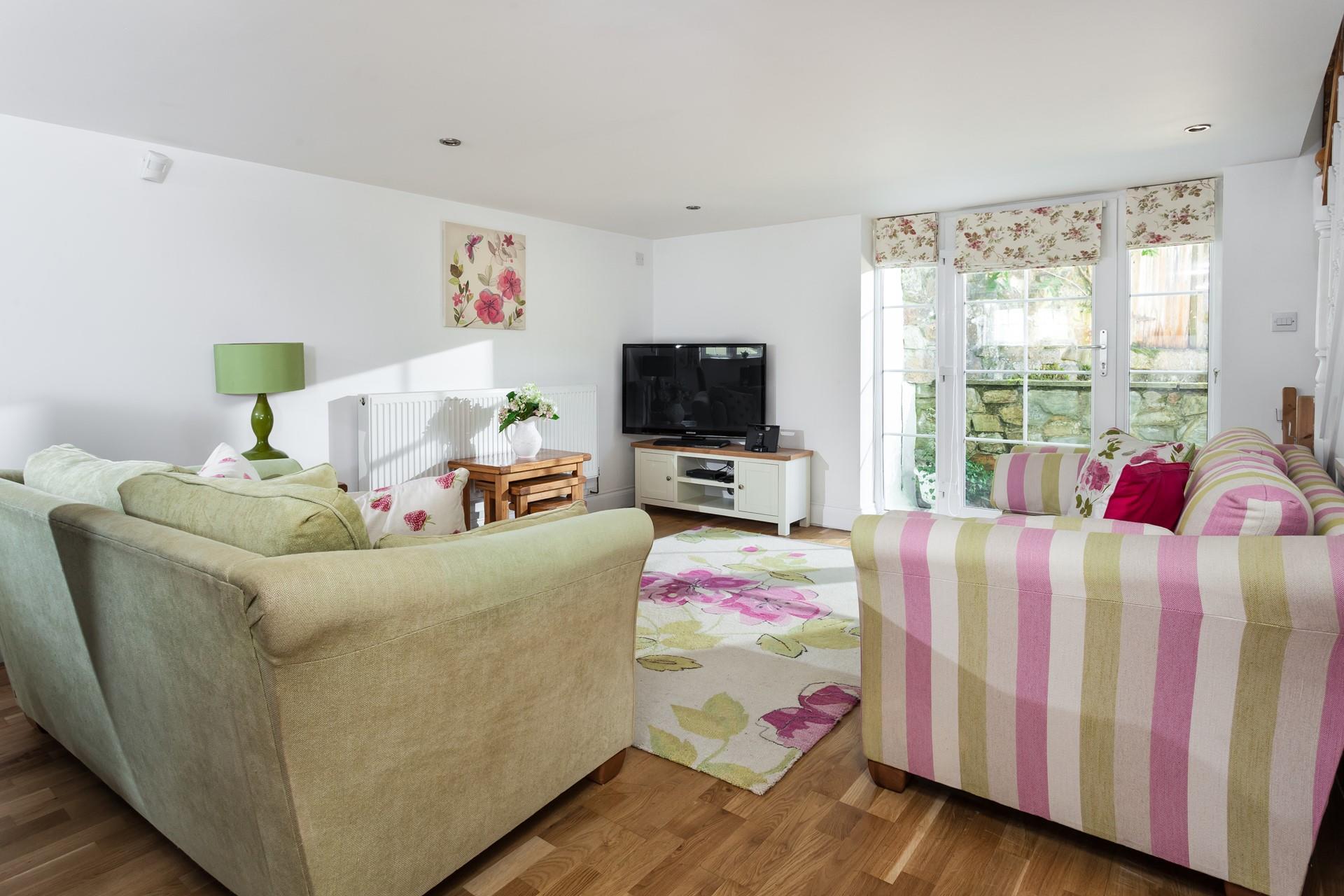 Pretty pastels and sweet florals make the lounge appear as though it is straight out of a fairytale!