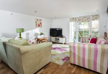 Pretty pastels and sweet florals make the lounge appear as though it is straight out of a fairytale!