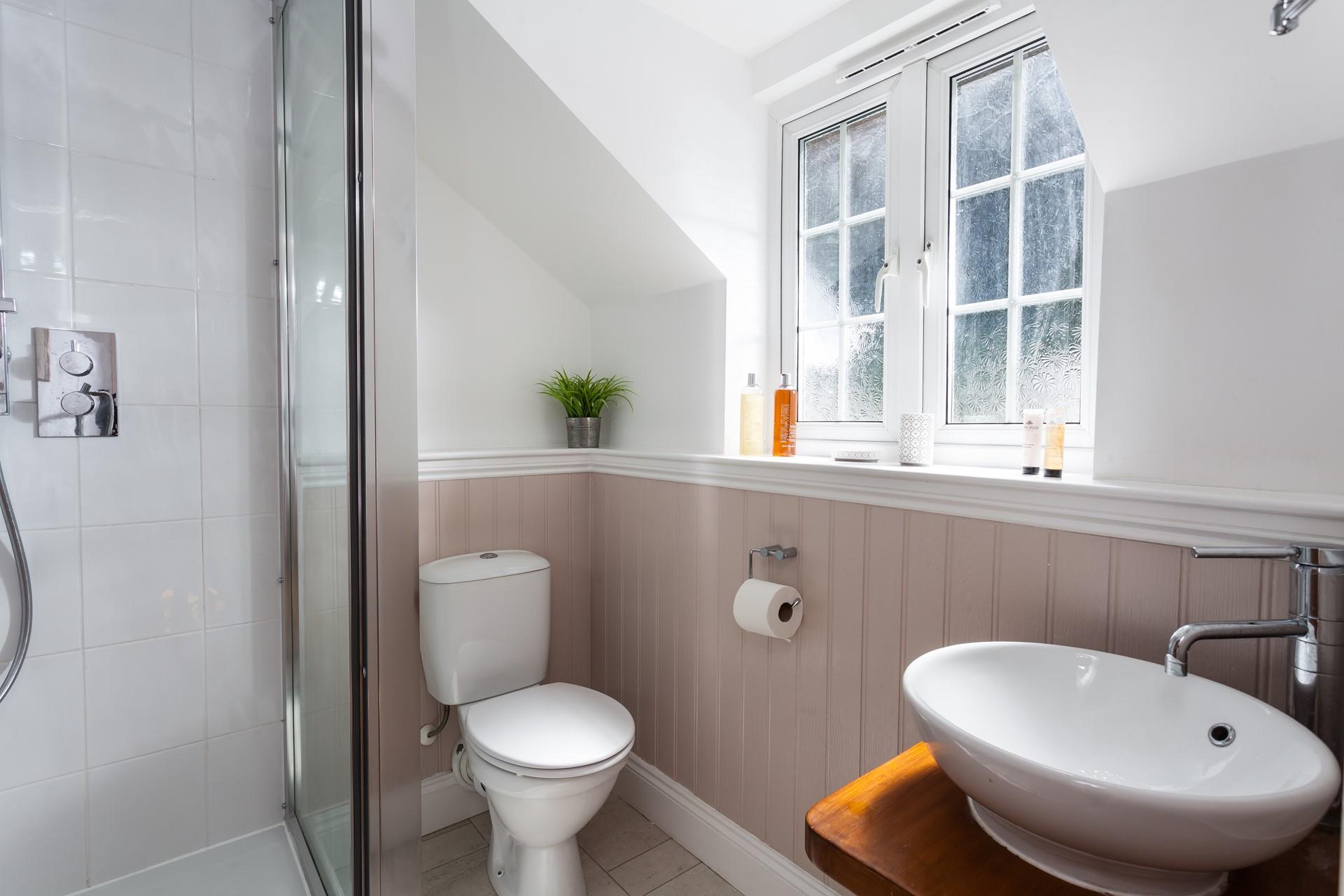 Bedroom 1's en suite provides additional space and privacy to get ready.