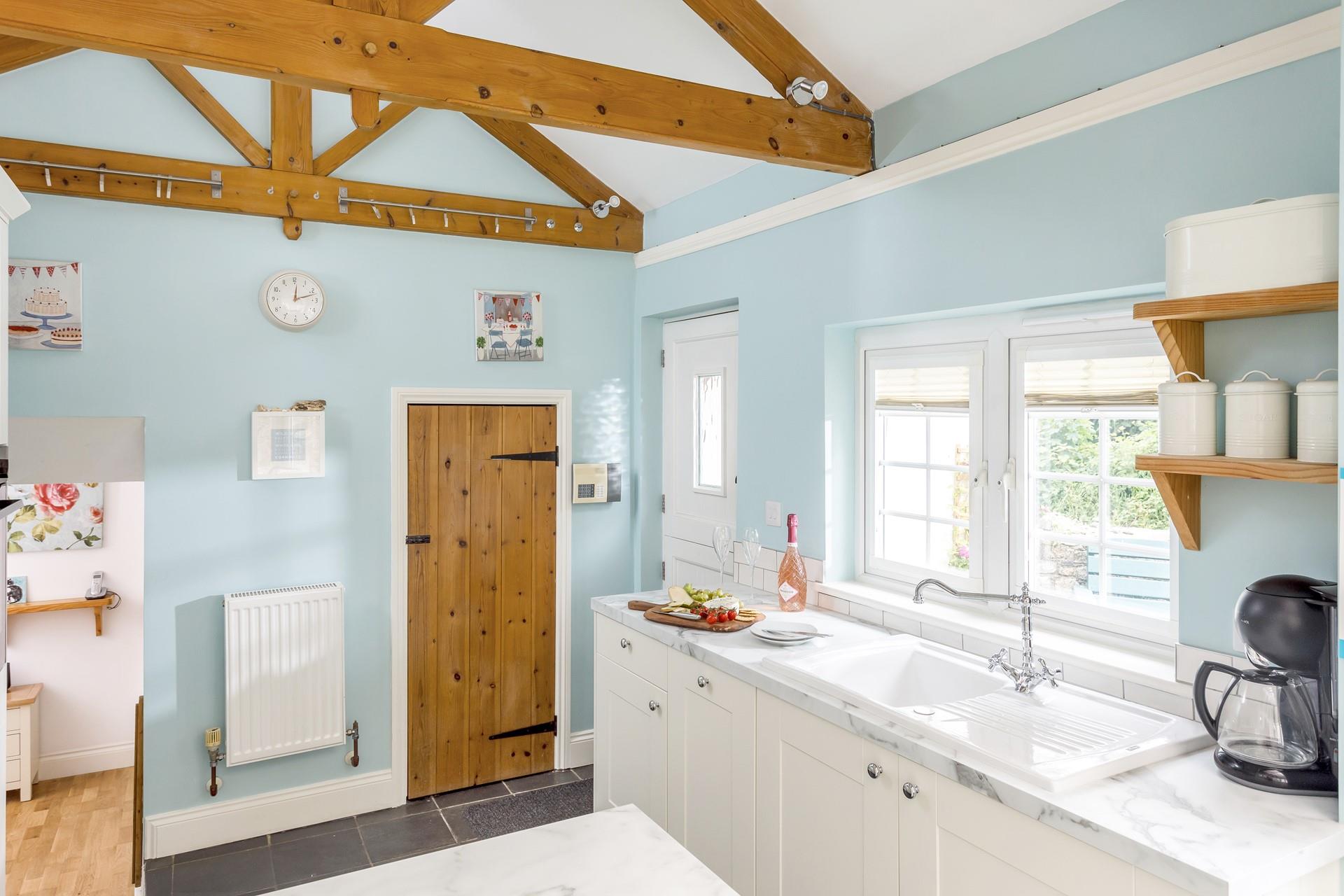 Exposed beams add to the character of this lovely cottage.