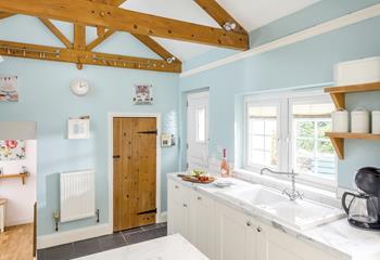 Exposed beams add to the character of this lovely cottage.