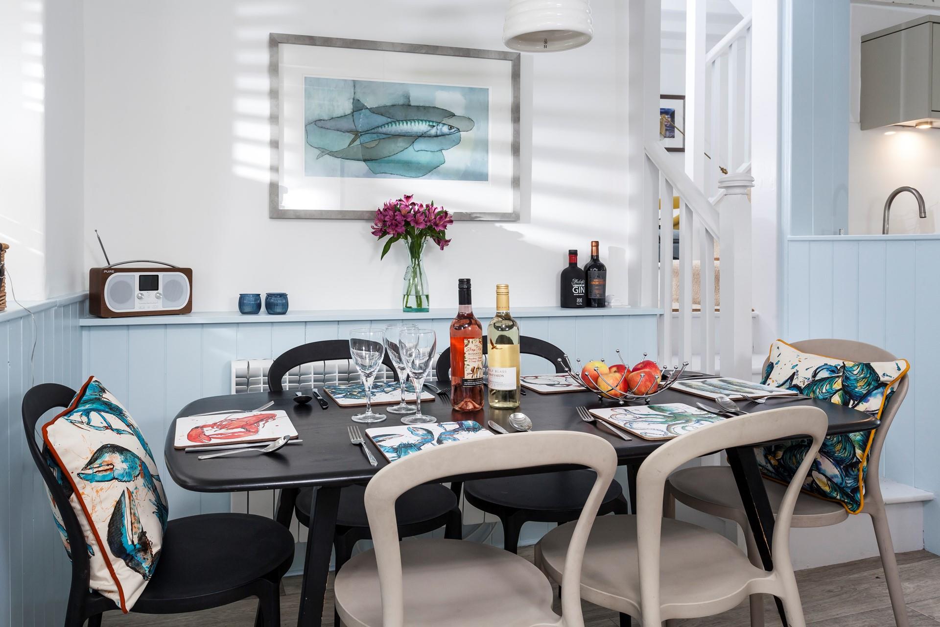 Gather all the guests around the dining table for a dinner of fresh locally caught fish.