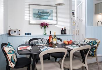 Gather all the guests around the dining table for a dinner of fresh locally caught fish.