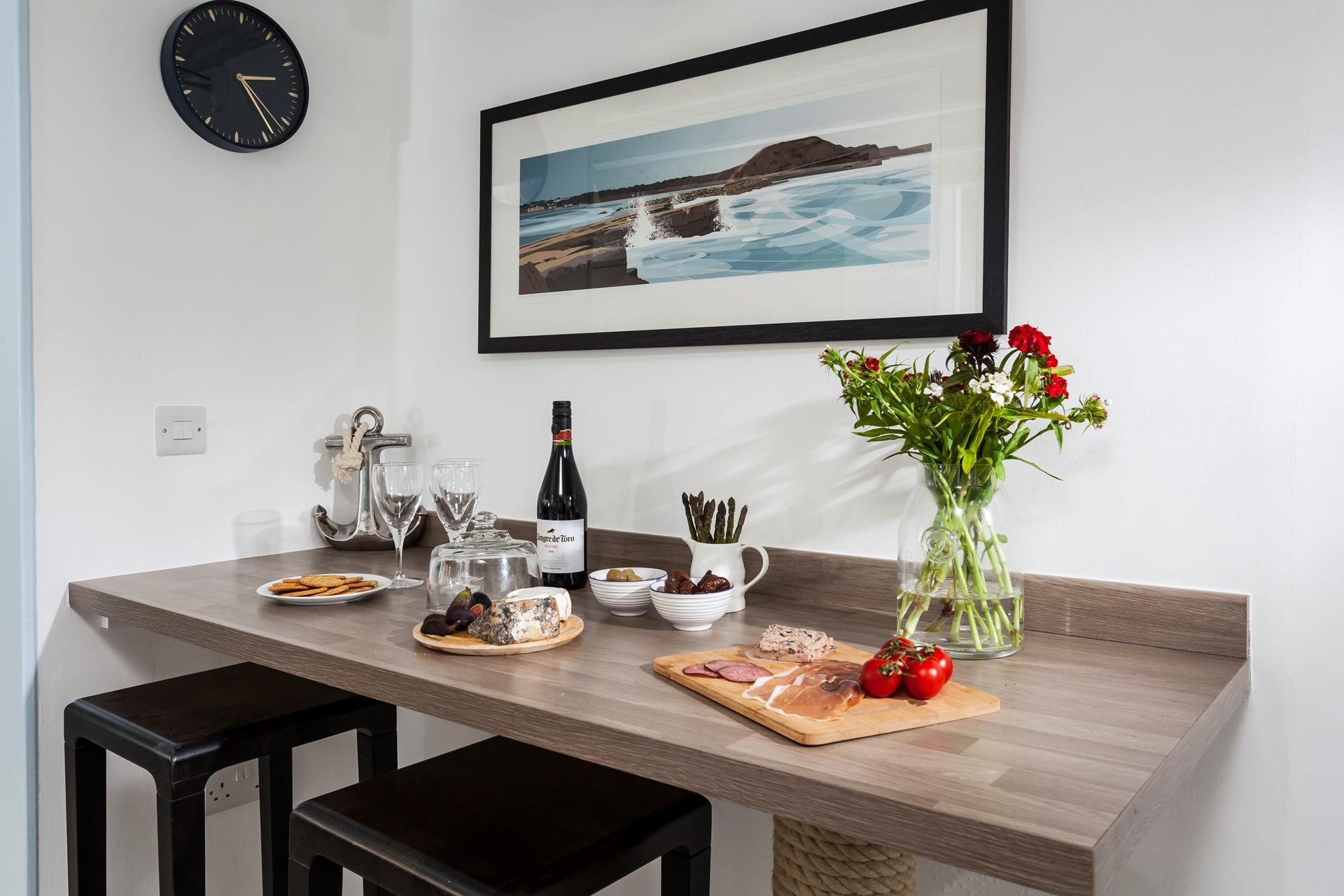 Indulge in nibbles and wine to unwind after a memorable day.