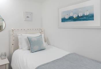 Bedroom 3 has a single bed and lovely boat artwork!