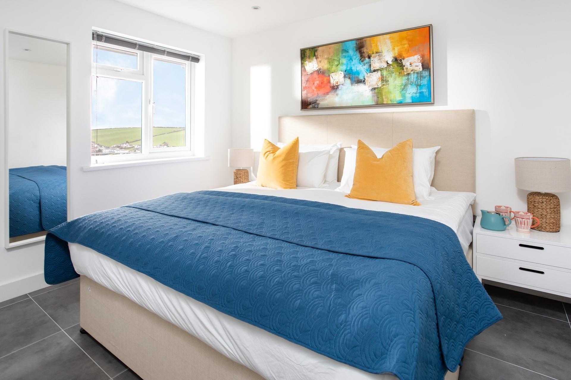 Nautical colours have created a fun yet soothing space whilst a super king size bed promises a blissful night's sleep.