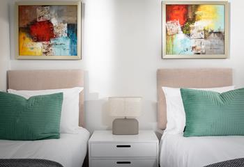 Abstract art adds a unique aspect to the rooms.