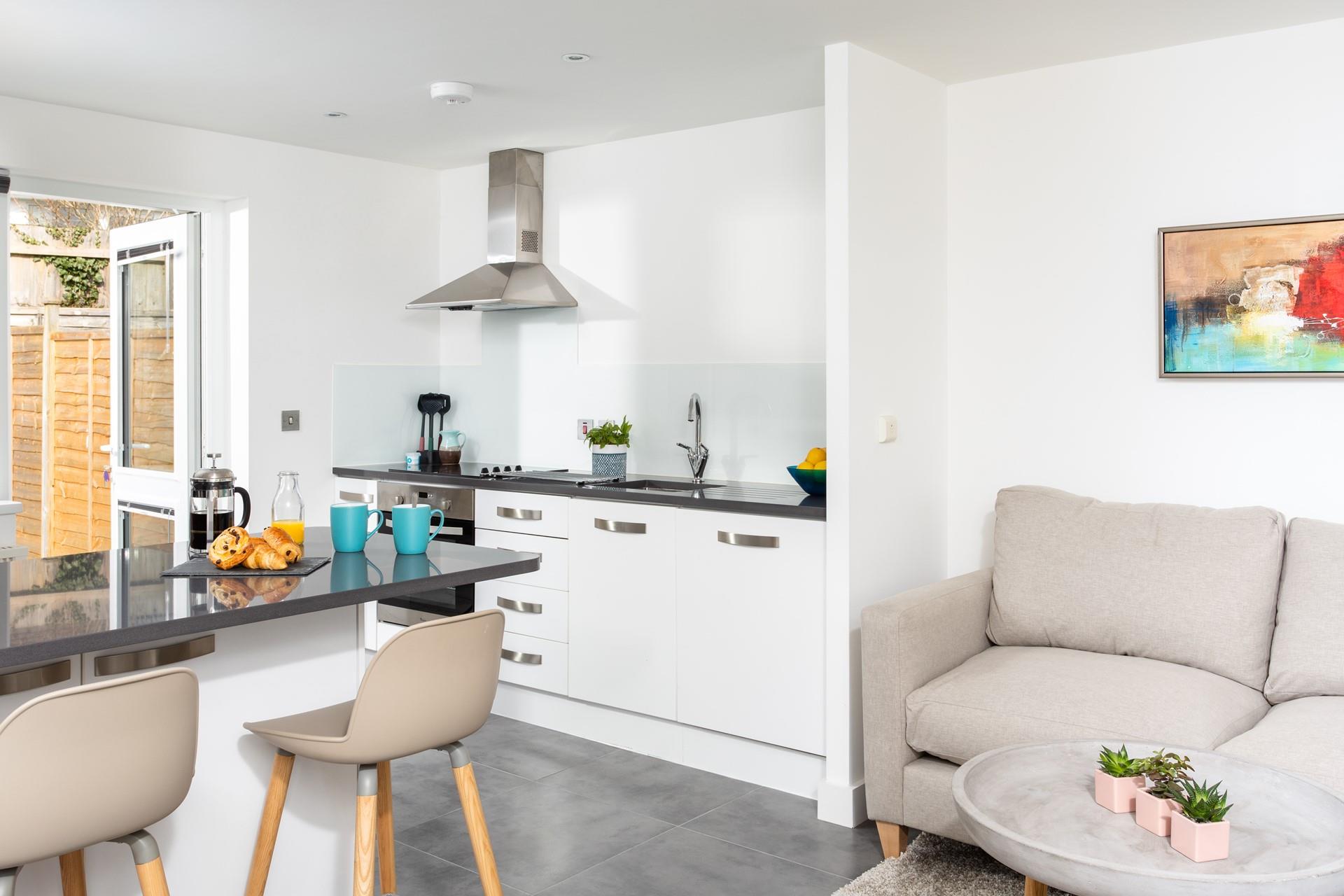 The super-stylish kitchen is compact yet well-equipped with everything you need to whip up scrumptious meals.