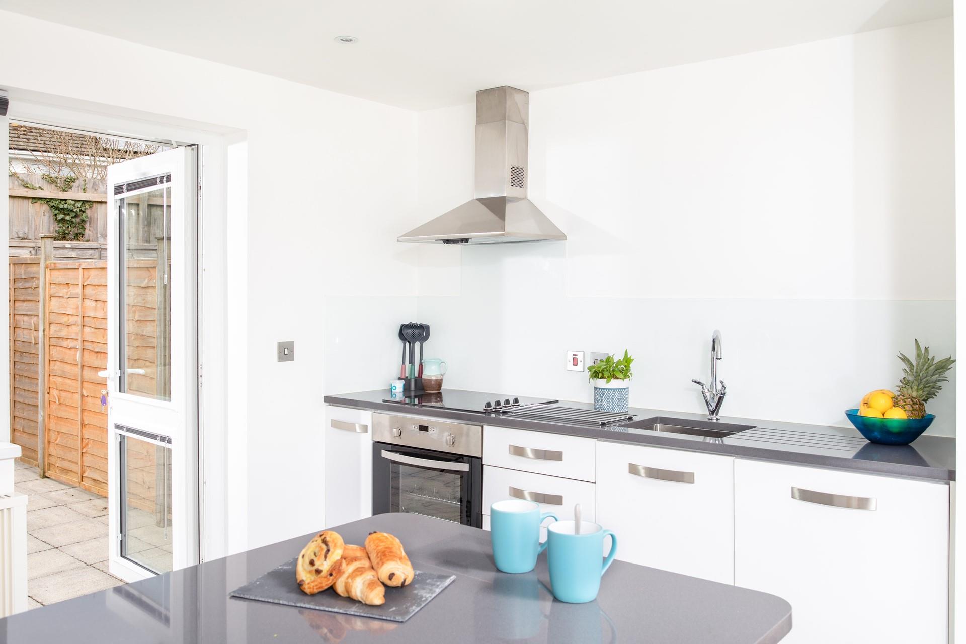 Modern fixtures and appliances make the kitchen a breeze to cook in.