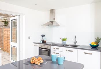 Modern fixtures and appliances make the kitchen a breeze to cook in.