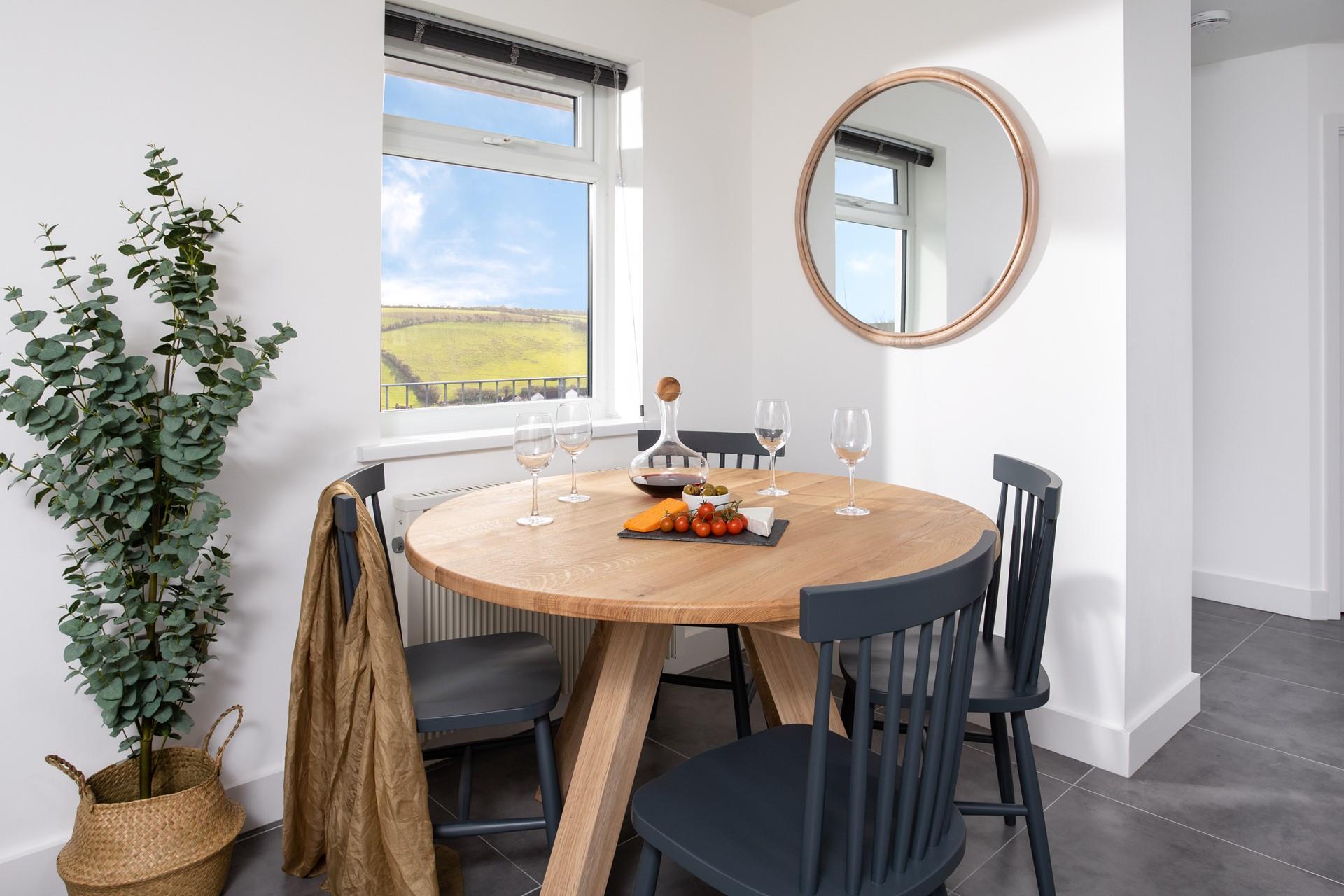 Gather at the table to indulge in a home-cooked dinner with a glass of wine in hand.