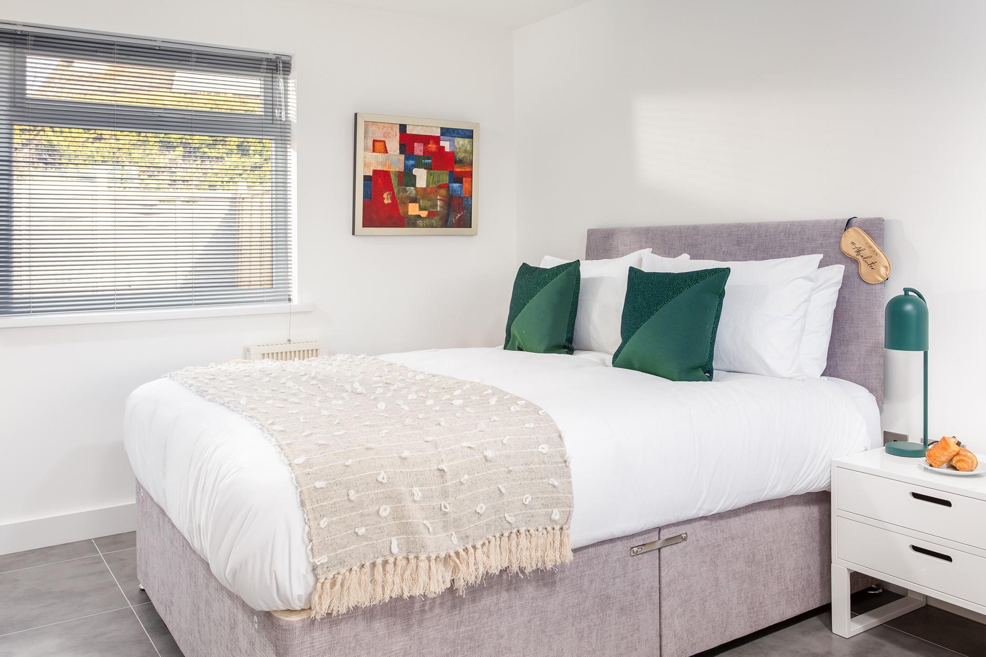 A double bed with a comfortable mattress and plush cushions combined with the peaceful location promises a blissful night's sleep.