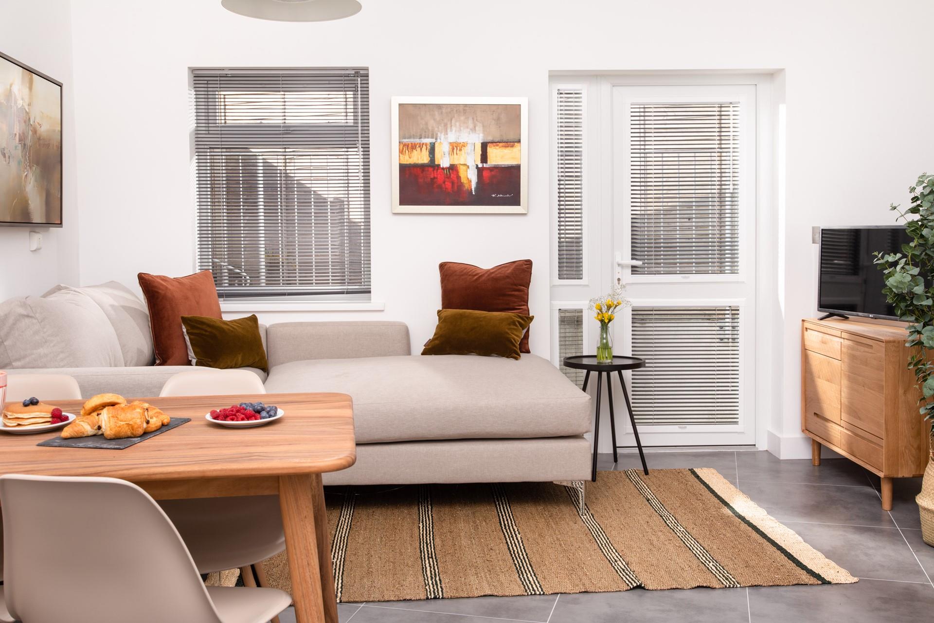 The cosy lounge area is a mix of modern and classic furniture, creating a chic and homely space to relax in.