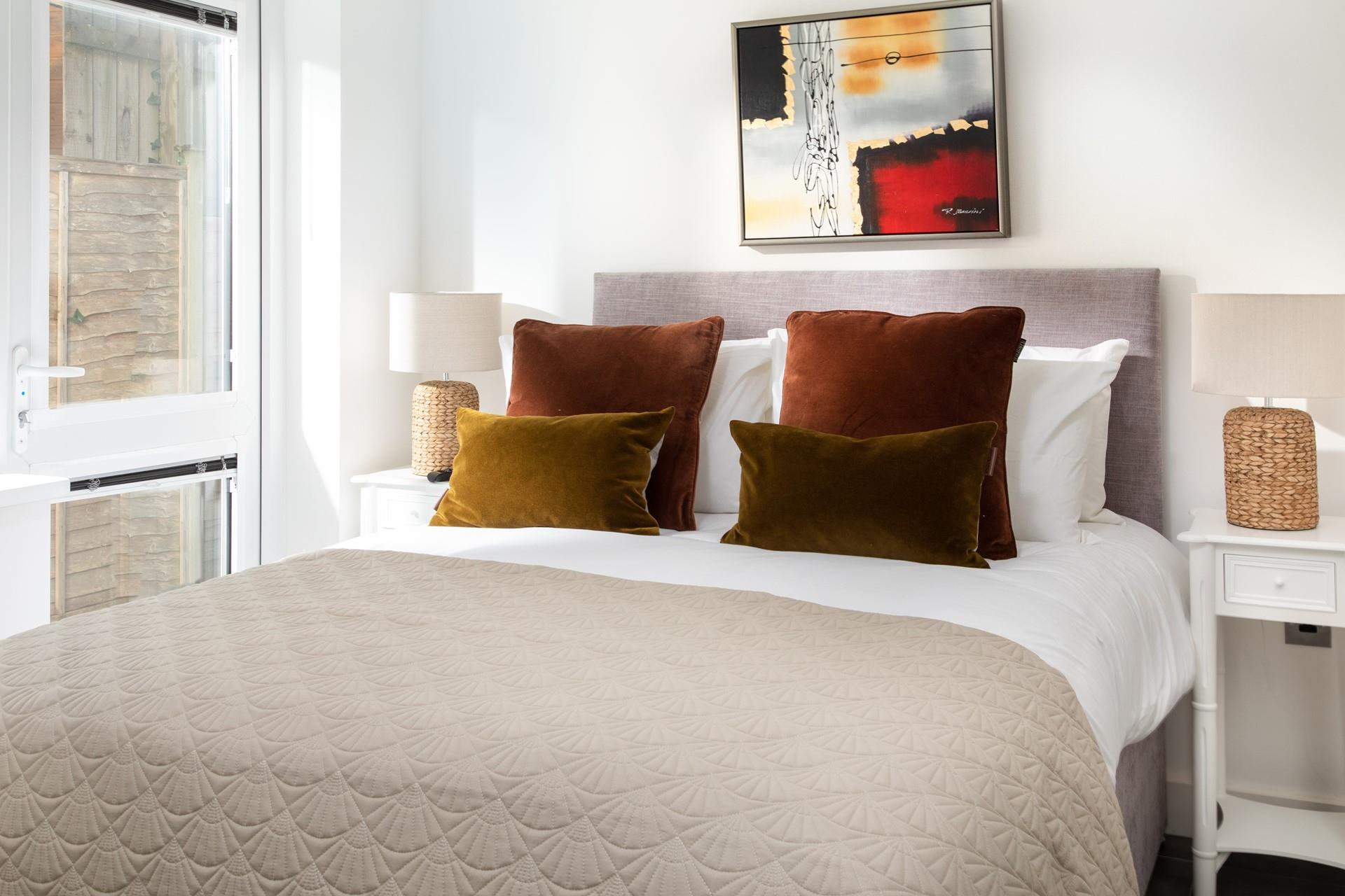 Warm, earthy tones in Bedroom 2 welcome you in, promising a fantastic night's sleep.