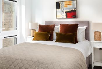 Warm, earthy tones in Bedroom 2 welcome you in, promising a fantastic night's sleep.