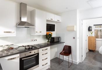 The kitchen is compact but carefully thought out to maximise space and fully equipped with everything needed to cook delicious meals!