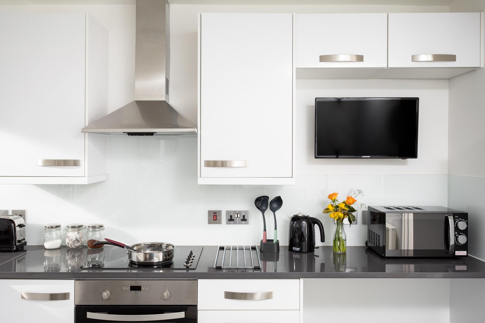 Sleek units and modern appliances make cooking in this kitchen a breeze!