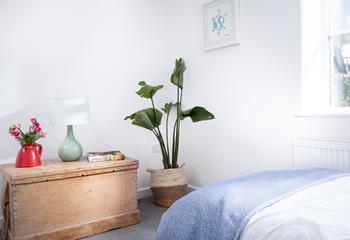 Plants add an extra touch of style to the bedrooms.