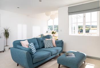 Airy and filled with light, pop your feet up in the lounge and enjoy a spot of quiet reading or gather your loved ones together for a movie night.