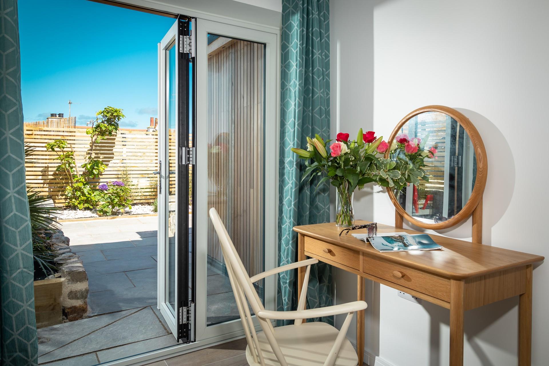 Patio doors lead to the outdoor area which is perfect for al fresco dining. 
