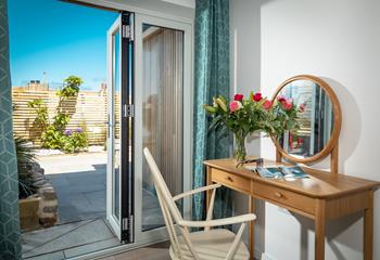 Patio doors lead to the outdoor area which is perfect for al fresco dining. 