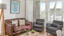 Snuggle down on the sumptuous sofa after a busy day exploring Cornwall's rugged coastline.