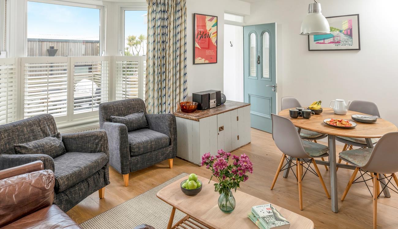 Soft seaside tones have created a relaxing haven where you can enjoy an evening of films and games.