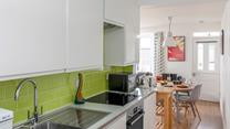 The bright and modern kitchen is well-equipped with modern appliances to make cooking delicious meals for your loved ones a breeze.