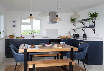 The chic kitchen and dining space is a delight to cook and eat in.