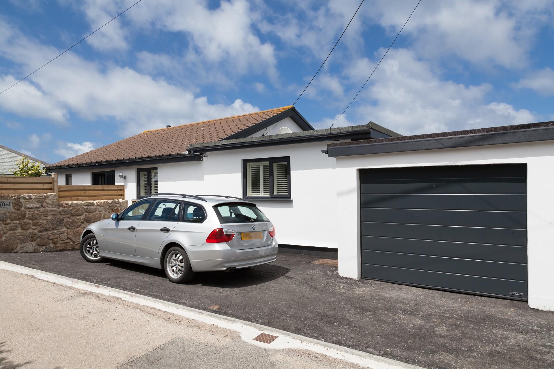 Parking outside for two cars, plus another space in the garage if needed.