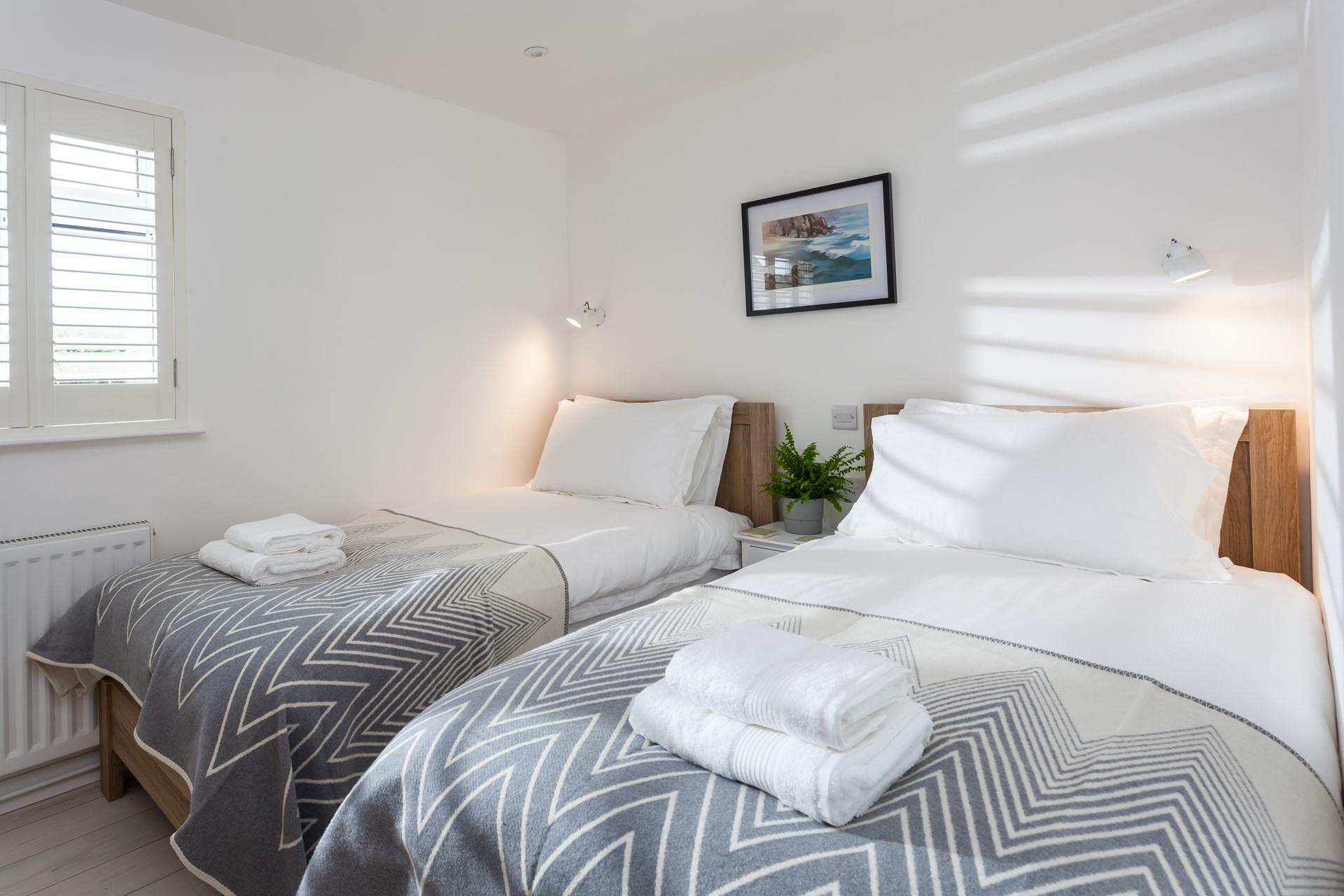 Adults or children will sleep well in the twin bedroom.