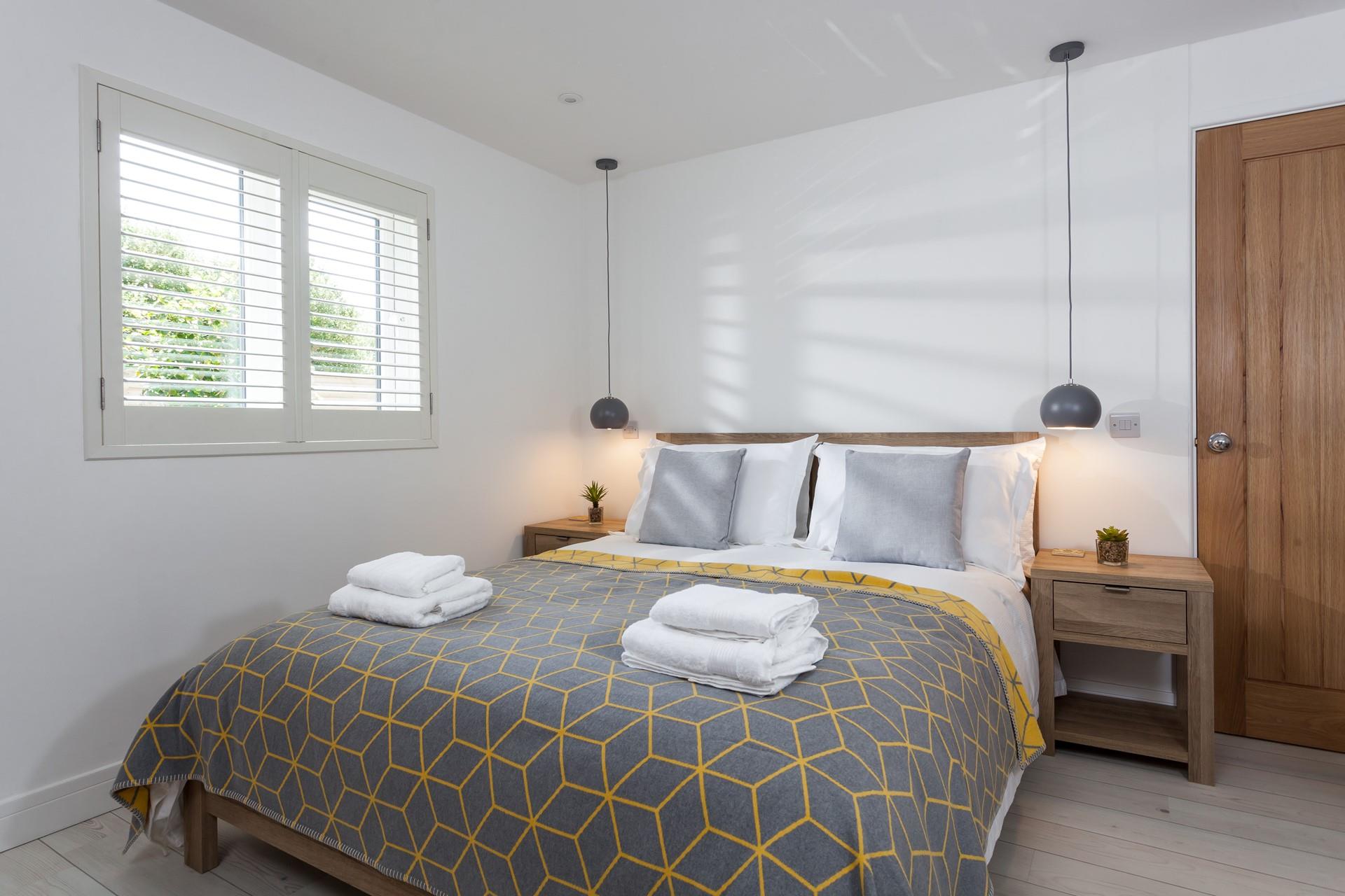 Rustic wood and soft linens create a calming retreat.