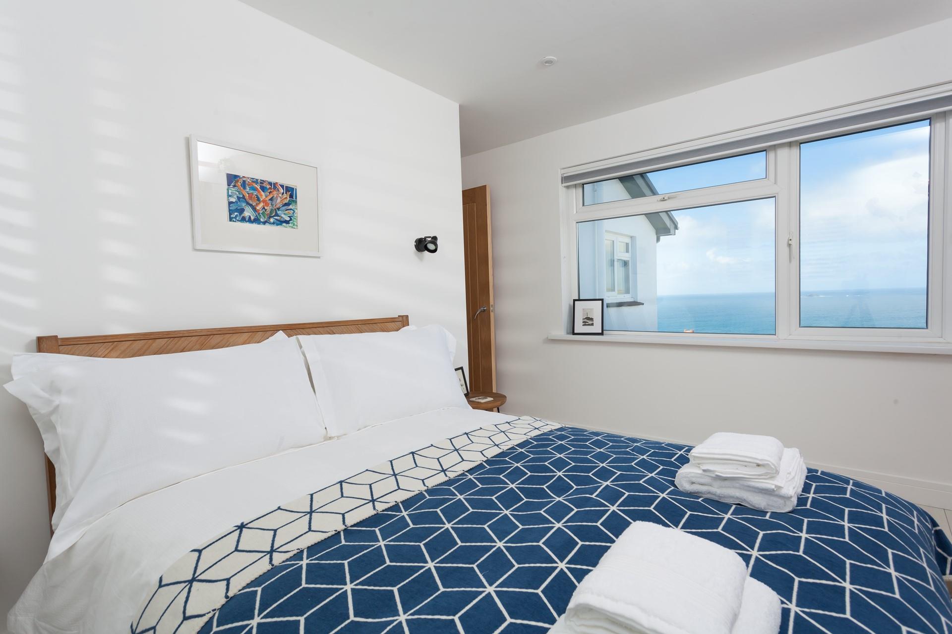 Open the blinds and enjoy the stunning sea view.