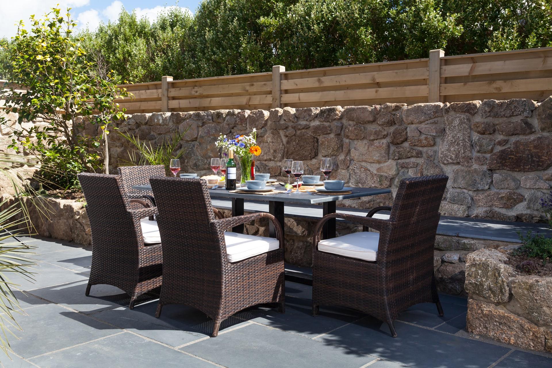 Dine in the Cornish sunshine, enjoying sea views.